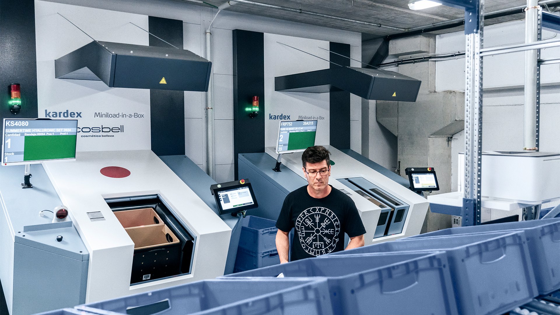 a man using kardex buffer systems in a warehouse