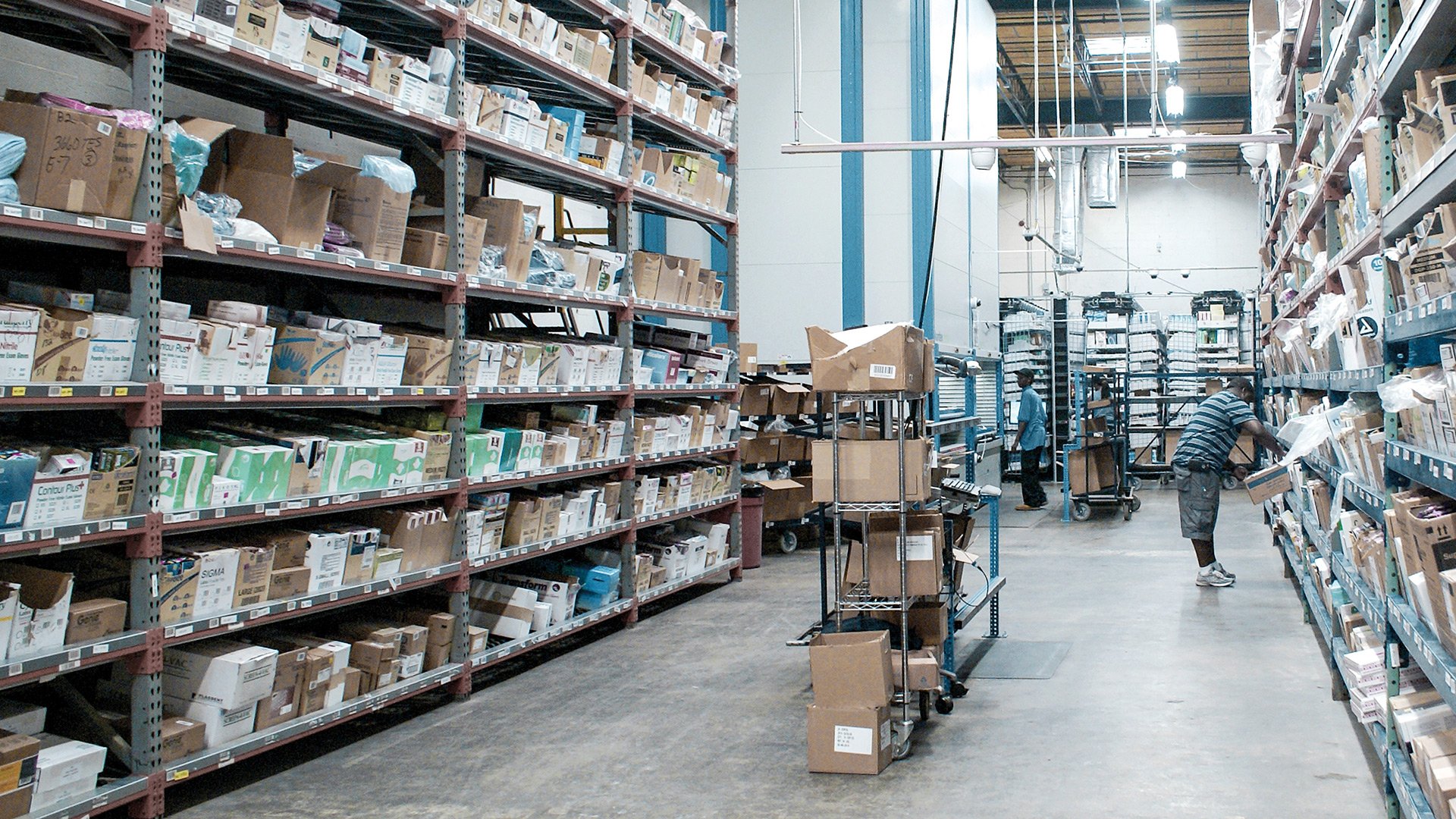 a busy high-SKU warehouse photo using traditional shelves