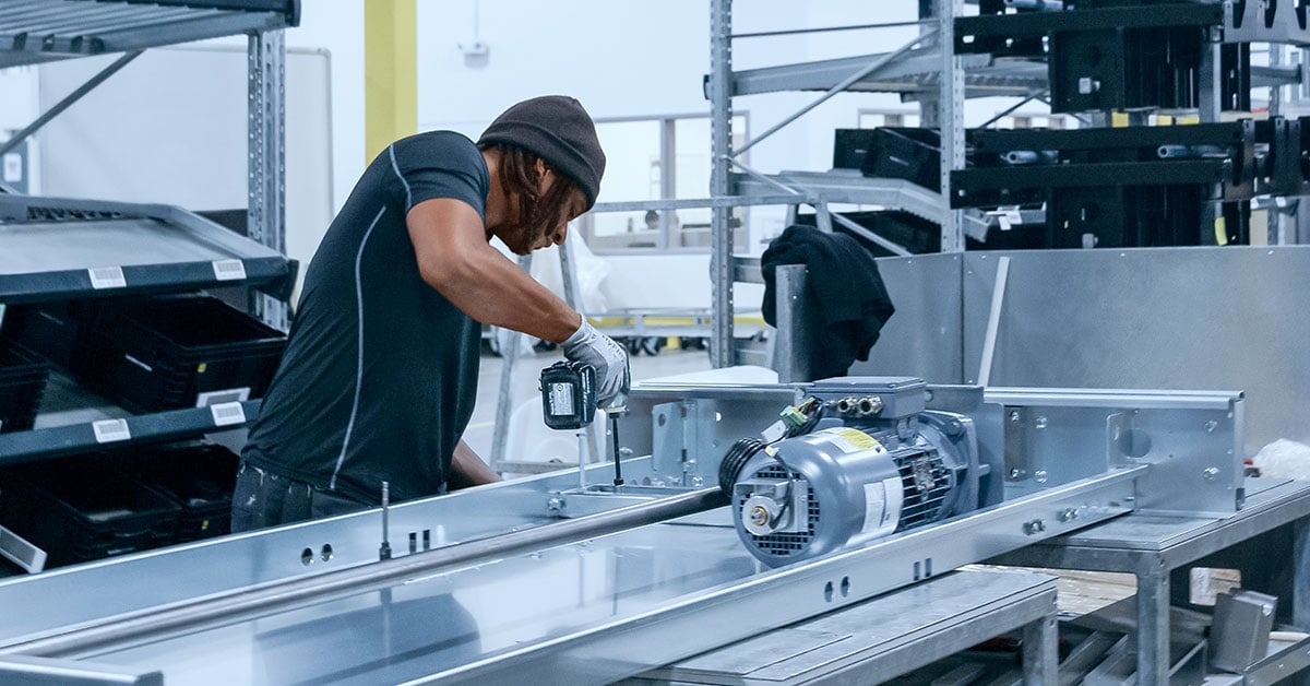 A worker using the tool he needs from the crib