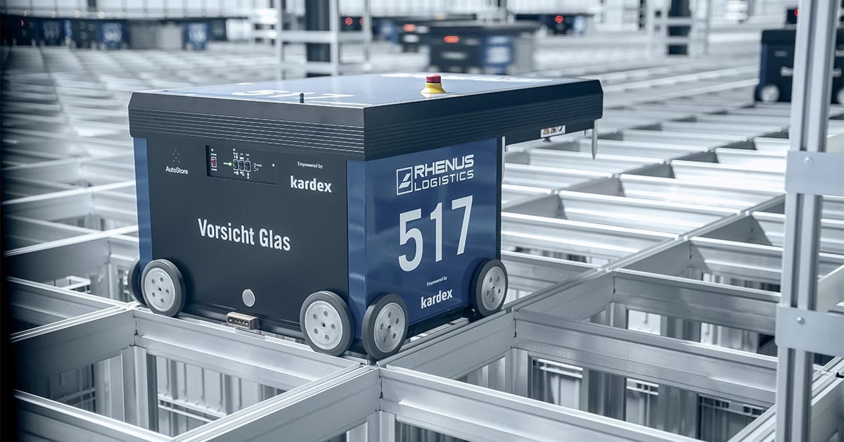 AutoStore robot on top of aluminum grid