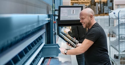 man using vertical asrs