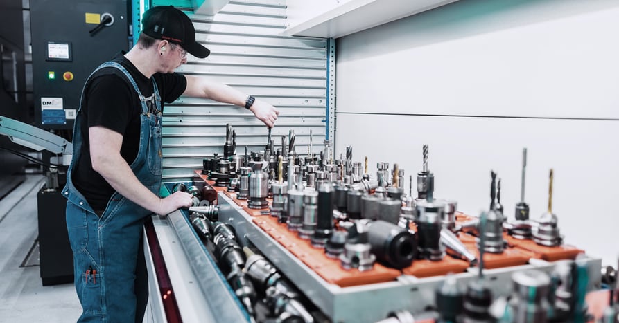 A worker selects the bit he needs from the automated tool crib