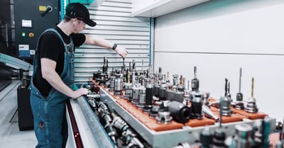 A worker selects the bit he needs from the automated tool crib