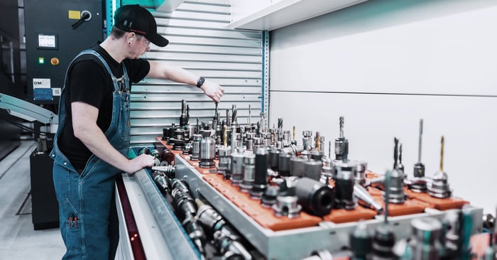 A worker selects the bit he needs from the automated tool crib
