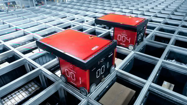 AutoStore R5 robots picking electric equipment from grid | Kardex